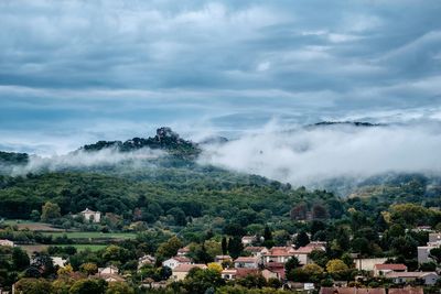 Scenic view of mountains against cloudy sky