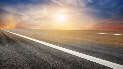 Road against sky during sunset