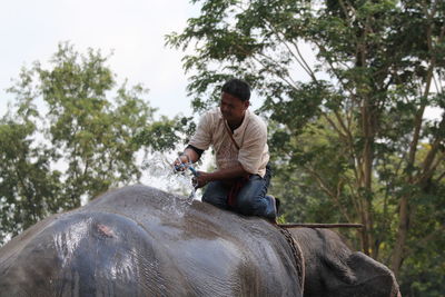 Full length of man riding horse