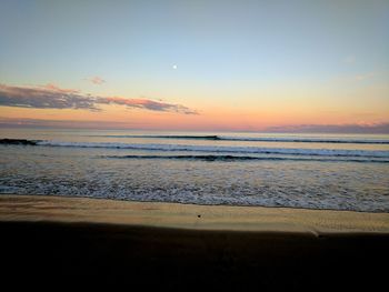 View of beach at sunset