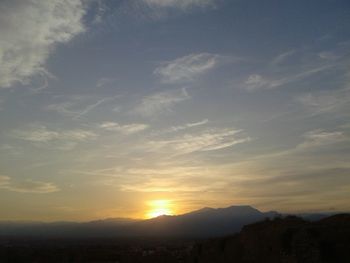 Scenic view of silhouette mountain against sky during sunset