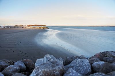 Scenic view of sea against sky during sunset