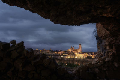 Buildings against cloudy sky