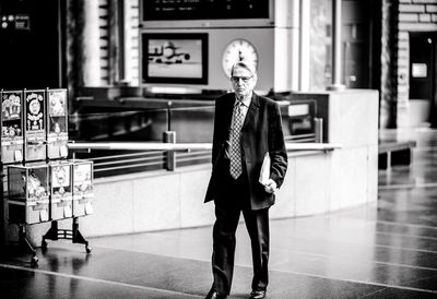 Full length of man standing in corridor