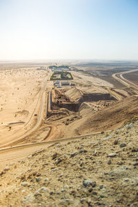 Aerial view of desert against clear sky