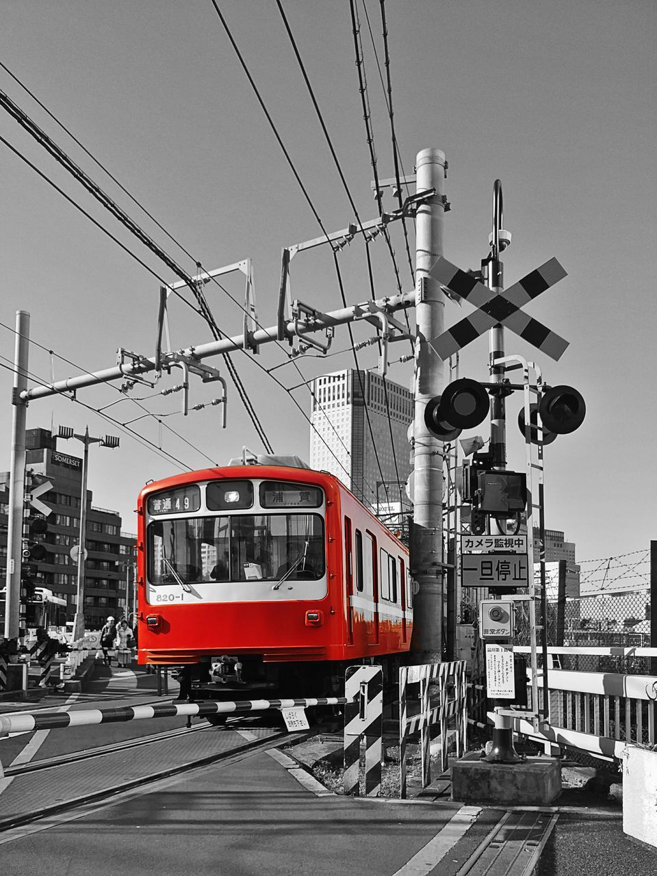 TRAIN ON RAILROAD TRACKS AGAINST SKY