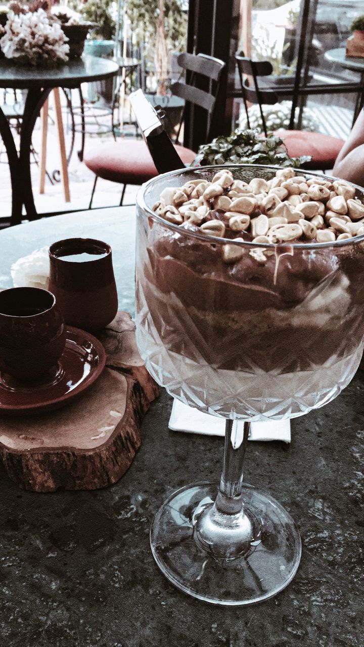 CLOSE-UP OF ICE CREAM ON TABLE AT CAFE