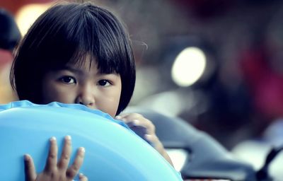 Close-up portrait of cute girl with inflatable ring 