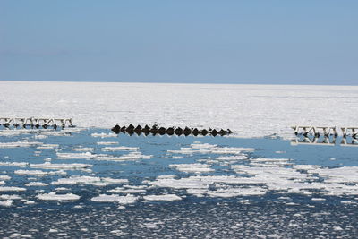 Winter frozen sea against sky