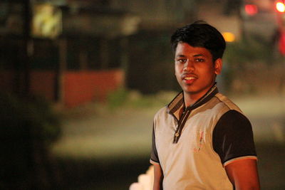 Portrait of young man standing outdoors