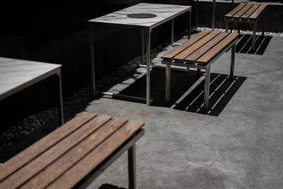 High angle view of empty chairs at table