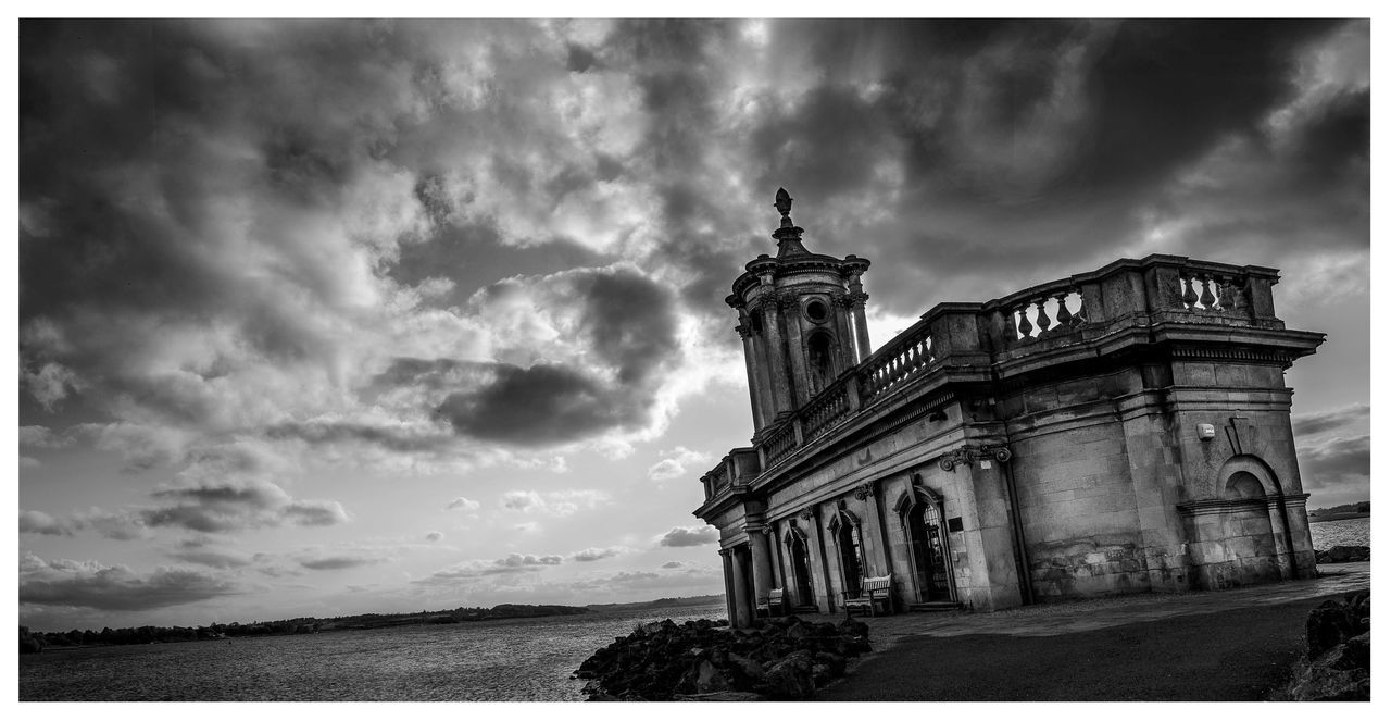 sky, cloud - sky, architecture, transfer print, built structure, cloudy, building exterior, auto post production filter, cloud, water, history, overcast, sea, weather, travel destinations, outdoors, famous place, nature, day, dusk
