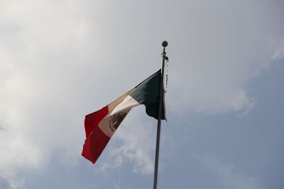 Low angle view of flag against sky