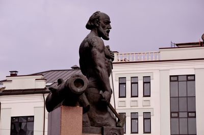 Low angle view of statue against sky