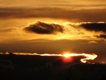 Scenic view of dramatic sky during sunset