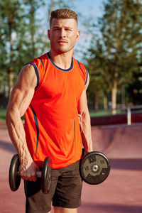 Portrait of woman exercising in gym