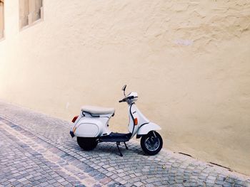 Close-up of scooter in street