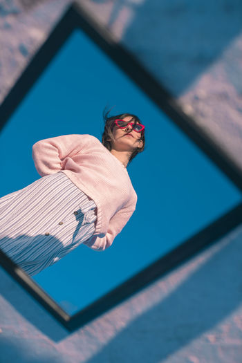 REFLECTION OF MAN IN SUNGLASSES