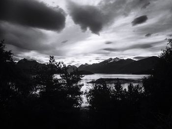 Scenic shot of calm lake against mountain range