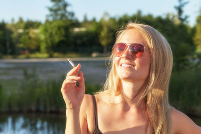 Portrait of woman wearing sunglasses