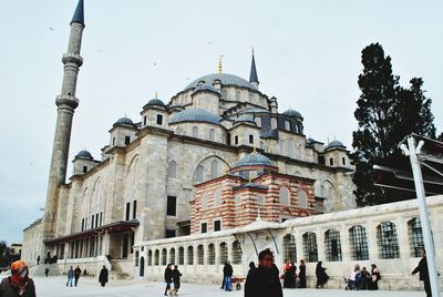 Tourists in front of building