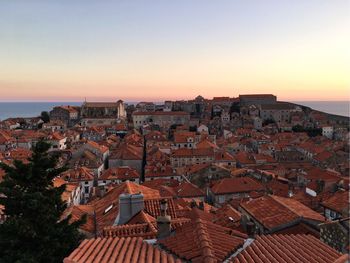 High angle view of town against sky during sunset