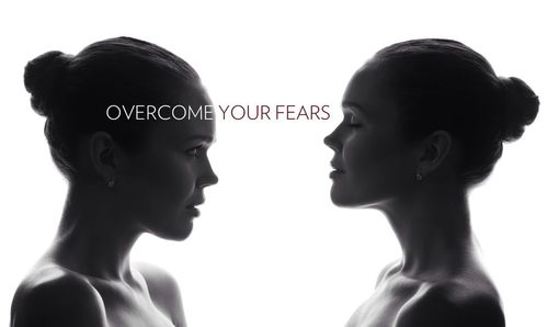 Portrait of young man against white background