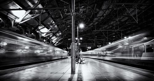 Blurred motion of train at railroad station at night