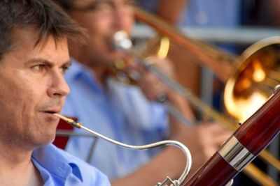 Close-up of male musicians playing musical instruments