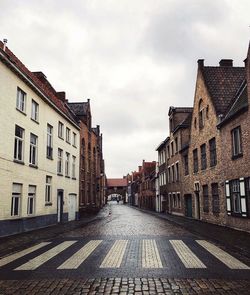 Houses against sky in city