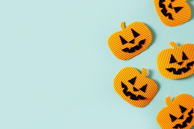 High angle view of orange art against white background