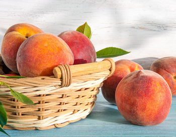 Close-up of apples in basket on table