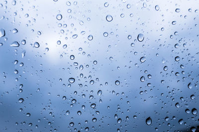 Full frame shot of wet glass window