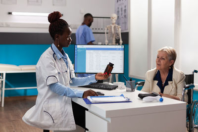 Female doctor working at clinic