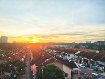 High angle view of townscape against sky during sunset