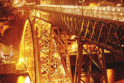 Illuminated bridge against sky in city at night