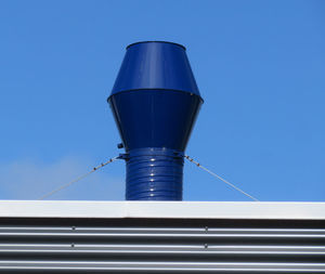 Low angle view of building against clear blue sky