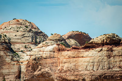 Low angle view of rock formations against sky