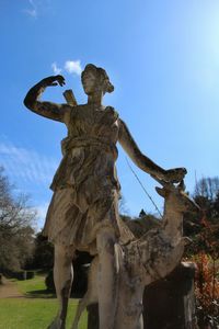 Low angle view of statue against sky