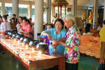 People standing on table