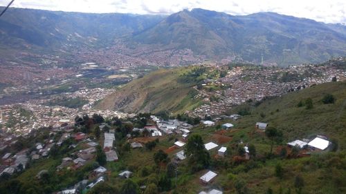 High angle view of townscape and mountains