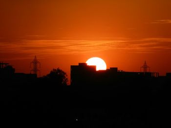 Silhouette of built structure at sunset