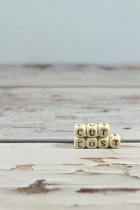 Close-up of objects on table against sea