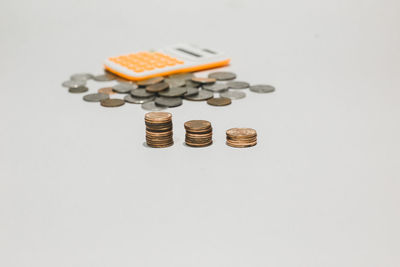 Close-up of coins on white background