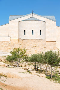 Low angle view of building against clear blue sky