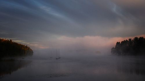 Scenic view of sea against cloudy sky