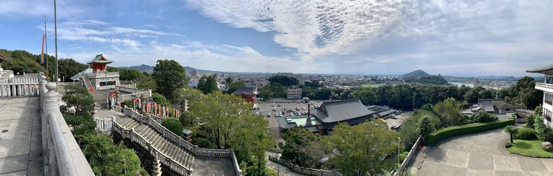 High angle view of trees and buildings against sky