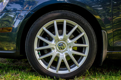 Close-up of damaged car on field