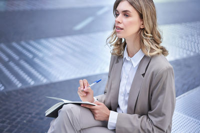 Portrait of businesswoman using mobile phone