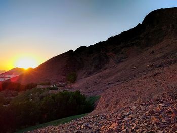 Scenic view of mountains against sky during sunset